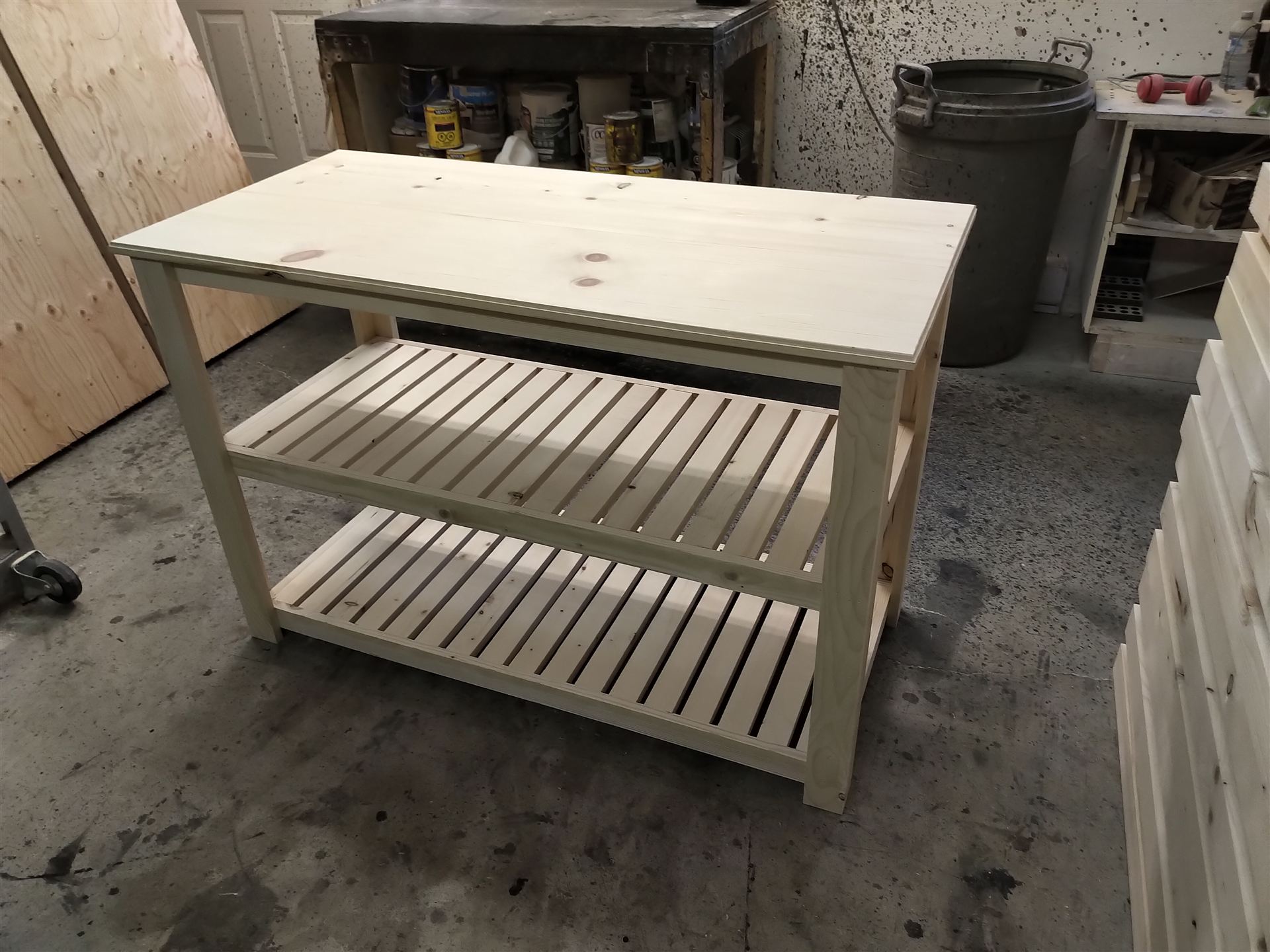 Pine console table with bullnose top edge and two slatted shelves