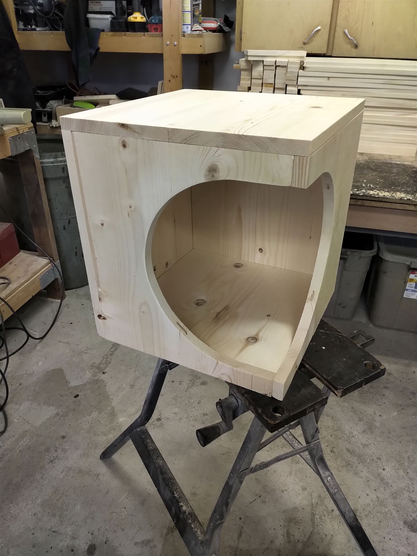 Pine pet house with a heart-shaped cutout entrance